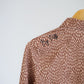 Women's Long sleeve Golf Polo - Terracotta Scattered Lies